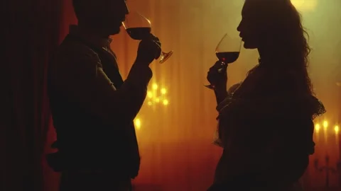 Black silhouette two gothic person, happy couple together man king drinking red Vídeo Stock 329623650