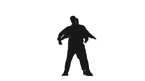 Black silhouette on white background, two girls dancing hip hop,isolated Stock Footage 113045288