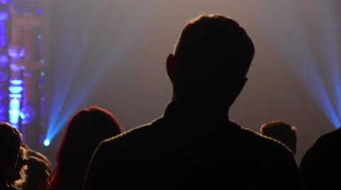 Black Silhouettes of People Sitting at a Concert Stock Footage 59076603