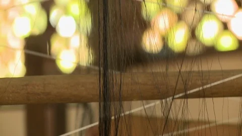 Black silk thread on a traditional spinning wheels 動画素材 115158530