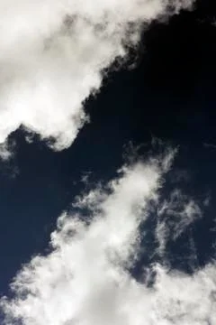 Black sky with white clouds dark mood space art fifty megapixels Stock Photos