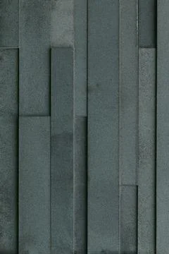 Black slate brick wall for pattern and background Stock Photos