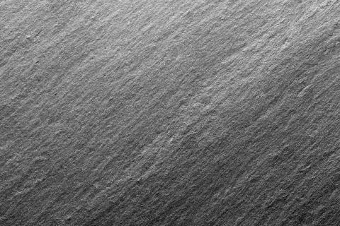 Black slate texture, floor tile, wallpaper or background. Stock Photos