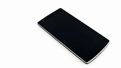 Black Smart Phone On White Background Panning Movement Stock-Footage 77006299