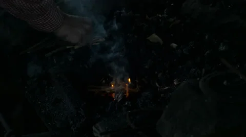 Black Smith Lights New Fire in Forge Stock Footage 67873118
