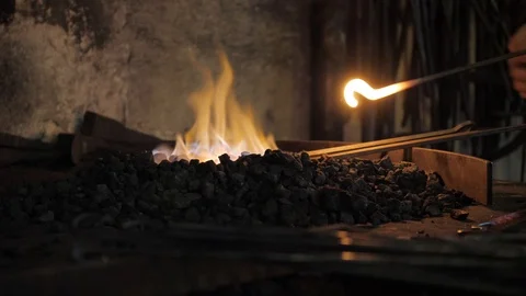 Black smith working in forge Видео 104746532