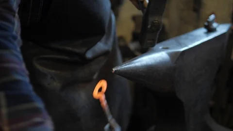 Black smith working in forge Видео 104747392