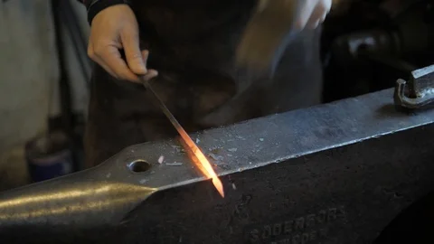 Black smith working in forge Видео 104747673