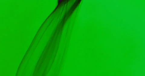 Black smoke floating through space against green background Stock Footage 106871983
