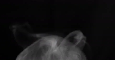 Black smoke floating through space against white background Stock Footage 106872624
