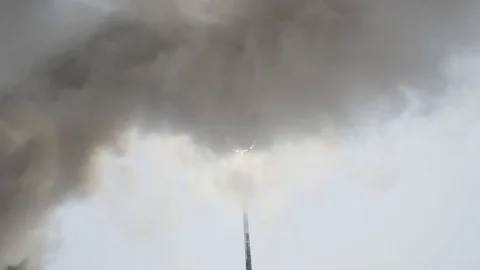 Black smoke rises, blocking the light from the lantern Stock Footage 125697708
