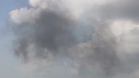 Black smoke is in the sky due to a fire causing air pollution Video stock 144384855