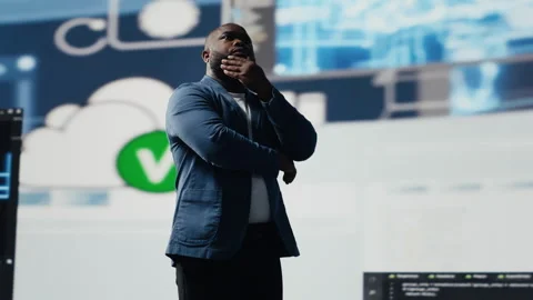 Black software developer immersed in code development Stock Footage 312360069