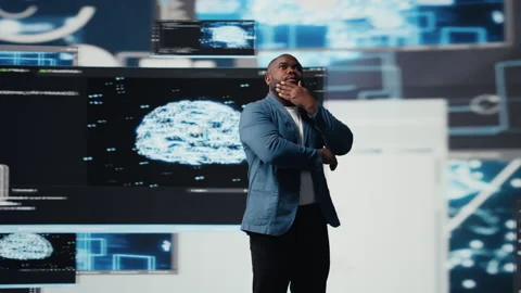 Black software developer immersed in code development Stock Footage 312478561