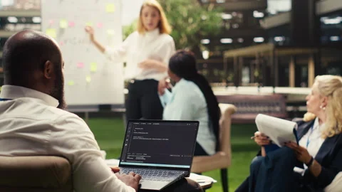 Black software developer working on programming code on laptop Stock Footage 338383889