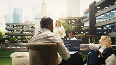 Black software developer working on programming code on laptop Foto stock
