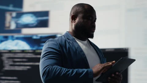 Black software expert focusing on programming language for innovation Stock Footage 312413789