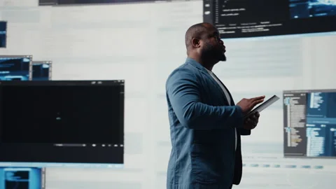 Black software expert focusing on programming language for innovation Stock Footage 312477967