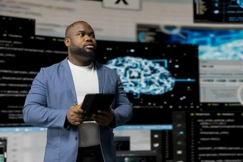 Black software expert focusing on programming language for innovation Stock Photos