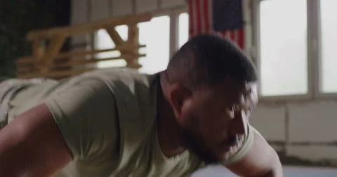 Black soldier doing push ups in gym Stock Footage 154485875