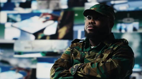 Black soldier operating in a virtual war zone using digital technology Stock Footage 312301810