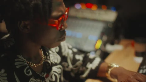 Black Sound Engineer Using Audio Mixer and Vibing to Beat in Recording Studio Stock Footage 302710446