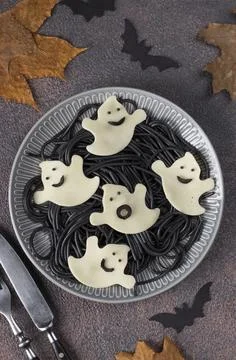 Black Spaghetti and Cheese Ghosts, Edible Halloween Idea, Top view Stock Photos