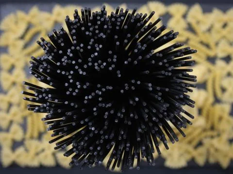 Black spaghetti. The background for the kitchen. Stock Photos