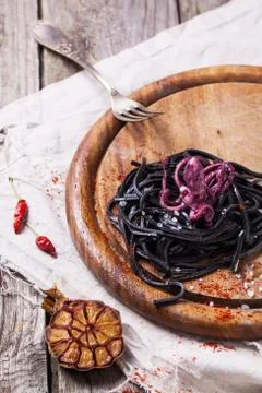 Black spaghetti with octopus Stock Photos