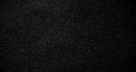 Black speckled texture slow rotation. Stock Footage 337773939