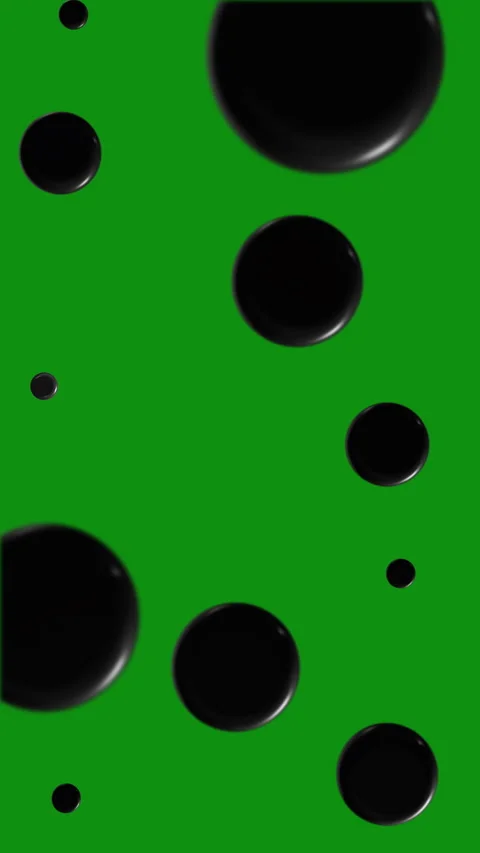 Black spheres on vertical green screen - versatile elements ready for your Stock Footage 302283802