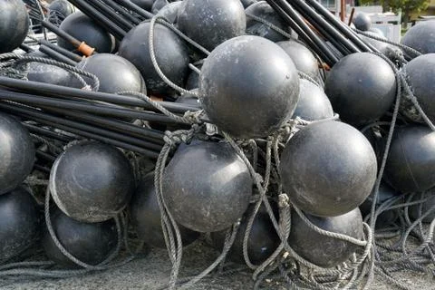 Black spherical plastic floats Stock Photos