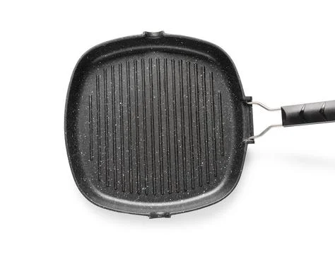 Black square grill pan with handle on white background Stock Photos