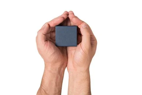 Black square small box in man hands. Present. White background. Top view Foto stock