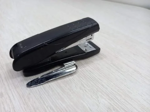 Black stapler on desk diagonal view. Image office 29 of 60 Stock Photos
