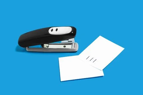 Black stapler with sheets of paper Stock Photos
