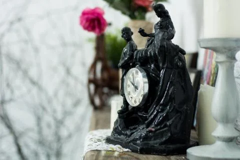 Black statuette of the clock, candlesticks Stock Photos