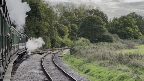 Black Steam train pulling the carrages forward Video stock 220458724