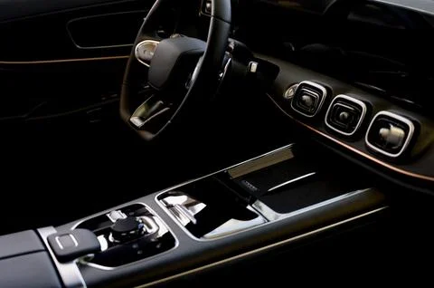 Black steering wheel and automatic transmission selector in a modern car Stock Photos