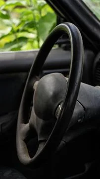 Black steering wheel and interior of the car, near Stock Photos