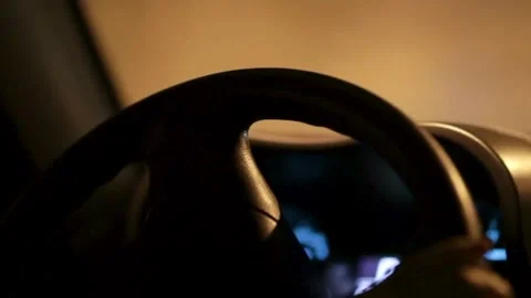 Black steering wheel inside car, drive in night city street. hands on steering Stock-Footage 336265523