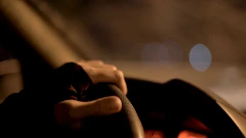 Black steering wheel inside car, drive in night city street. hands on steering Vídeo Stock 336265685