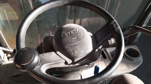 Black steering wheel warning button, shaking during forklift truck operation Stock Footage 157799775