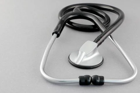 Black stethoscope on a gray background Stock Photos