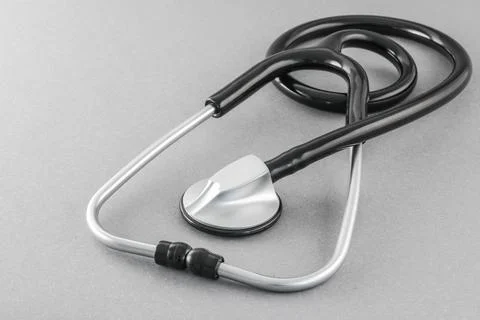 Black stethoscope on a gray background Stock Photos