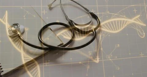 Black stethoscope resting on grid-patterned workbench, with notebook edge, DNA Stock Photos