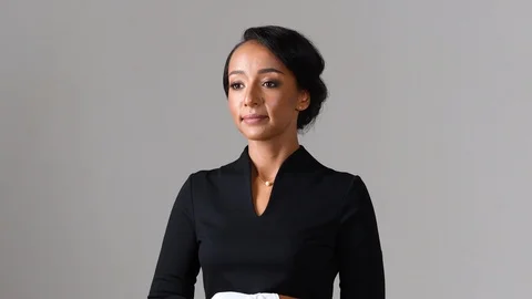 Black stewardess on gray background Stock Footage 97981825