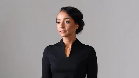 Black stewardess on gray background 스톡 동영상 97982046