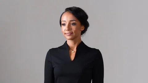 Black stewardess on gray background 스톡 동영상 97982425