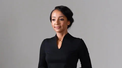 Black stewardess on gray background 스톡 동영상 97983447